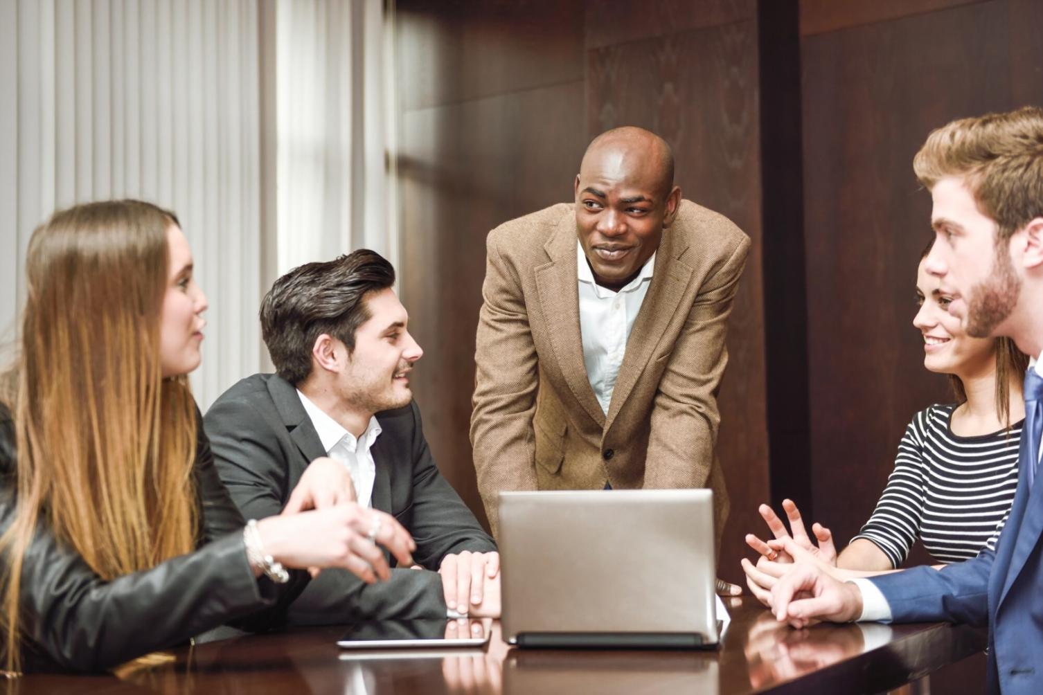 Family reviewing financial documents and budget plans together at home